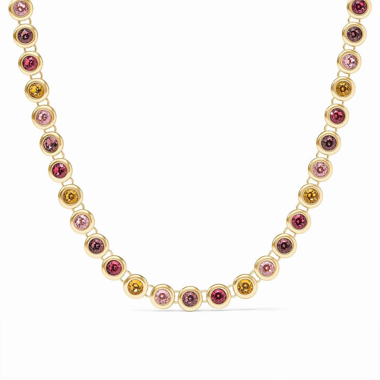 Adjustable rainbow tennis necklace with vibrant multicolored stones set in a polished gold plate chain.