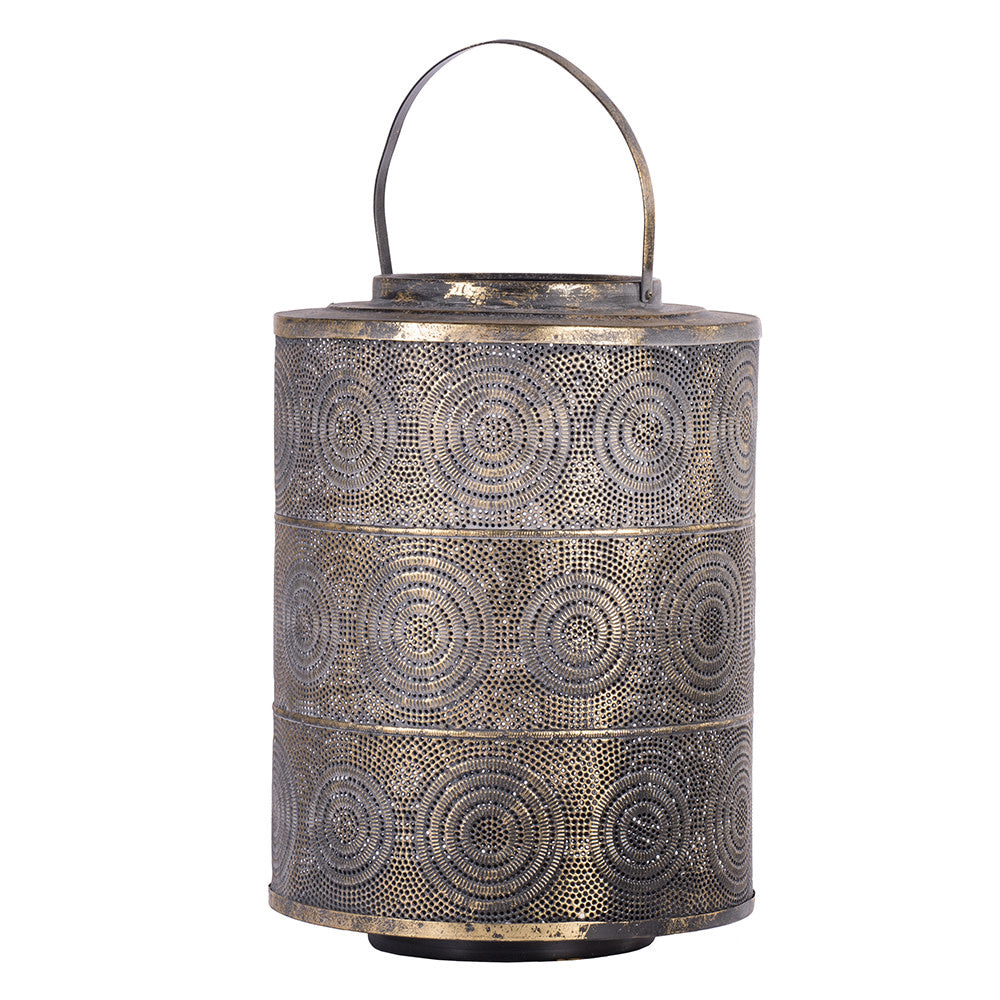 Black iron Raj lantern with intricate perforations diffusing candlelight