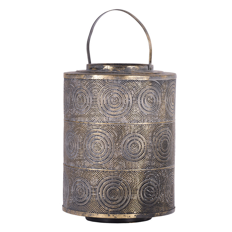 Black iron Raj lantern with intricate perforations diffusing candlelight
