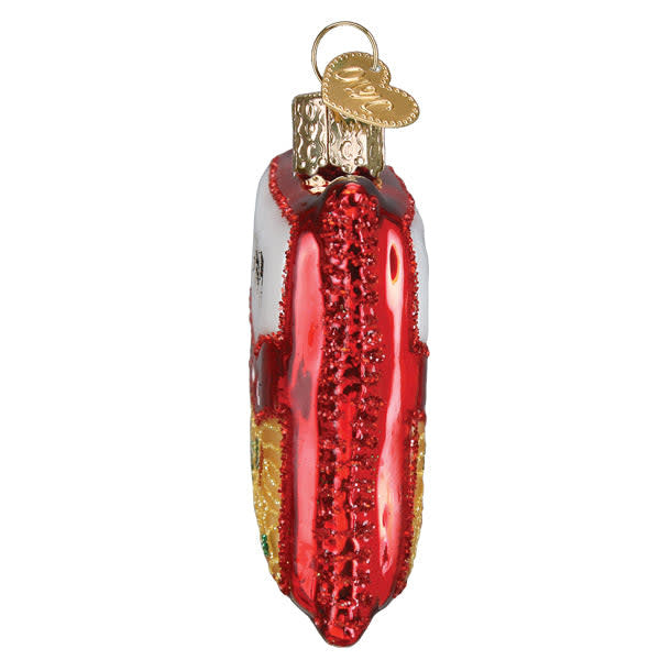 Side view of a Ramen Noodles ornament featuring a white bowl with red noodles and green garnish.