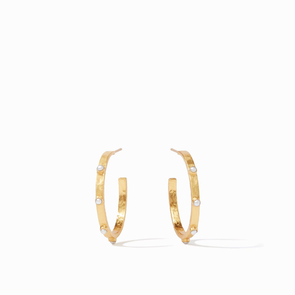 Lightly hammered gold hoop earring with gemstone accents.