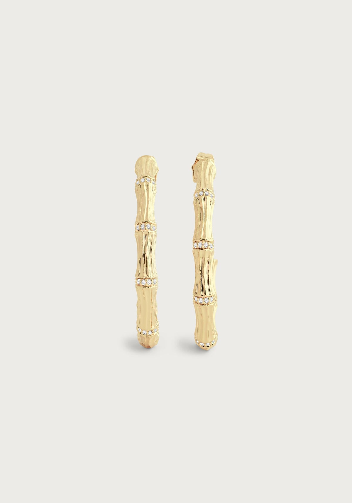 Pair of 18K gold-plated bamboo-shaped hoop earrings with crystal pavé accents.