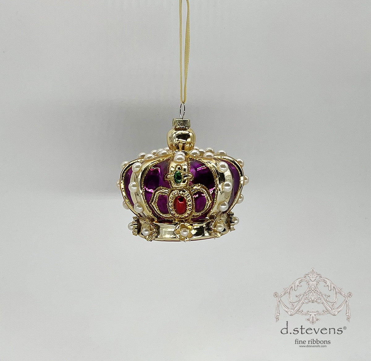3.875-inch glass regal crown ornament in purple and gold with pearl accents and red and green gems.