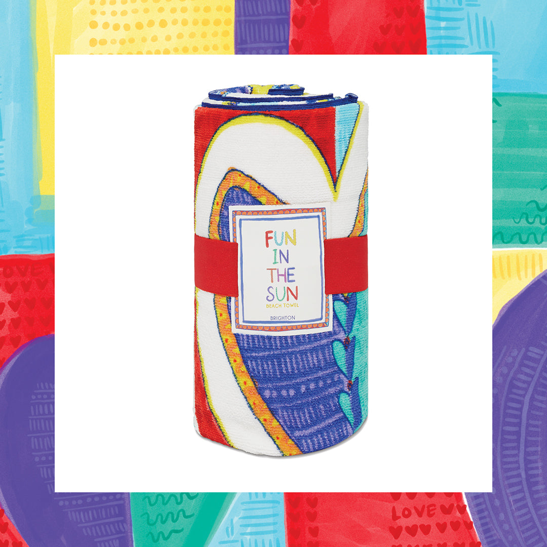 Rolled Endless Summer Beach Towel with colorful abstract patterns and a 'Fun in the Sun' label.