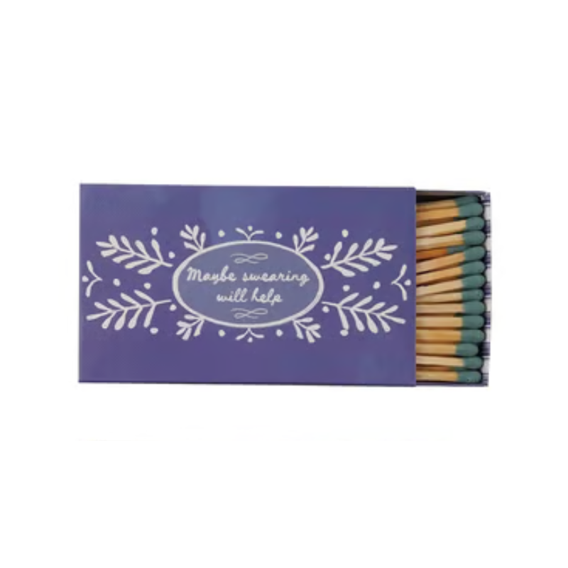 Purple matchbox with floral design and text 'Maybe swearing will help' containing green-tip matches.