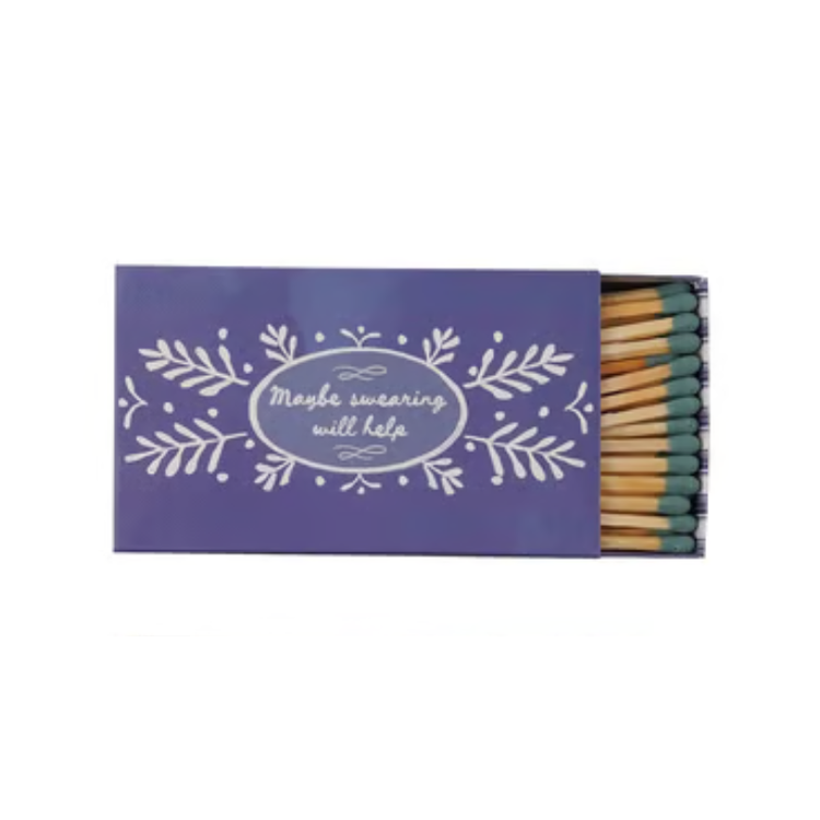 Purple matchbox with floral design and text 'Maybe swearing will help' containing green-tip matches.