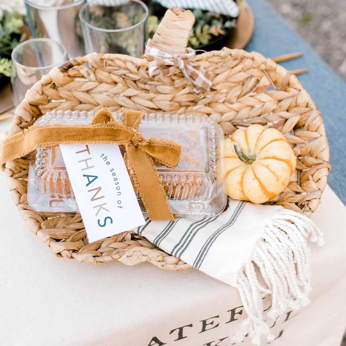 Woven pumpkin-shaped bowl made from water hyacinth with a natural tan color and textured surface.