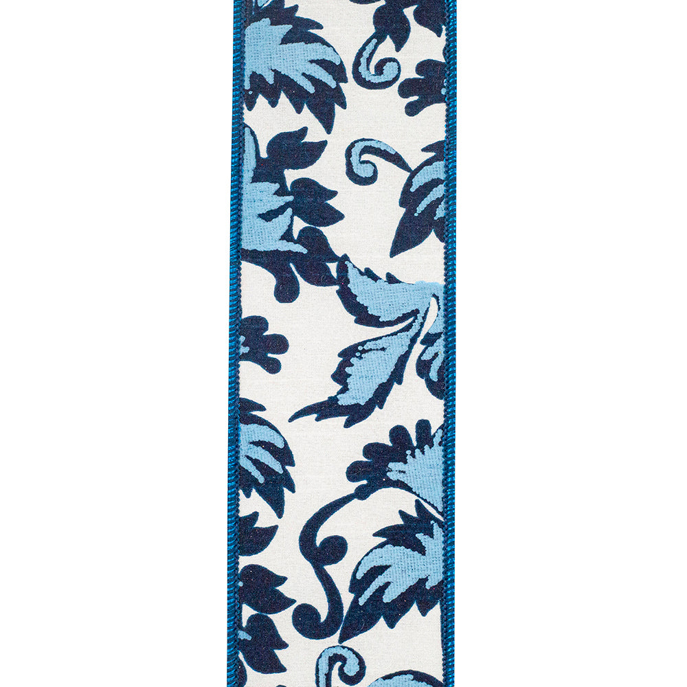 2-1/2 inch white wired edge ribbon with a blue and navy scroll leaf pattern.