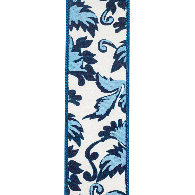 2-1/2 inch white wired edge ribbon with a blue and navy scroll leaf pattern.