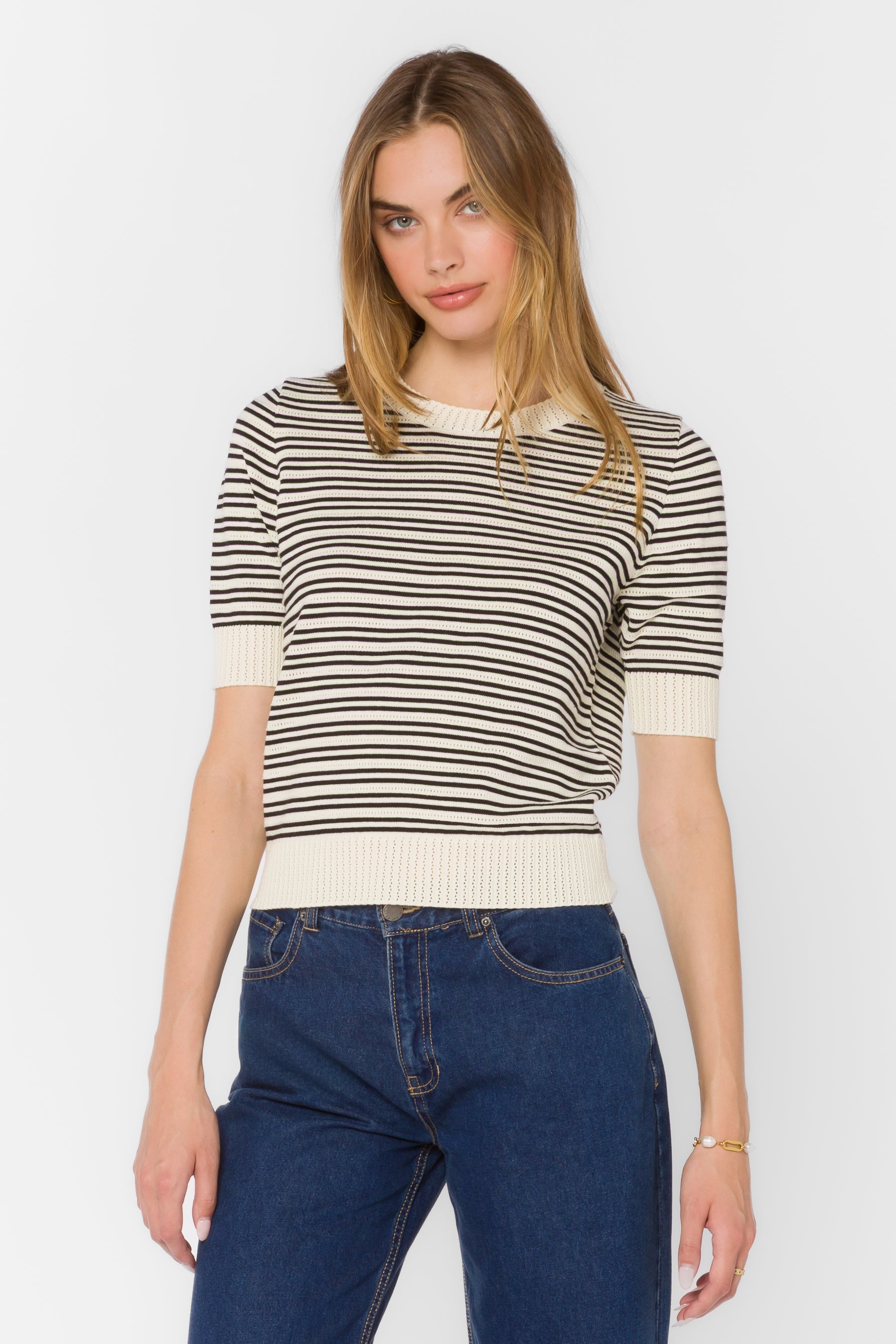 Norine Stripe Sweater in white cotton with black horizontal stripes, short sleeves, and ribbed crew neckline.
