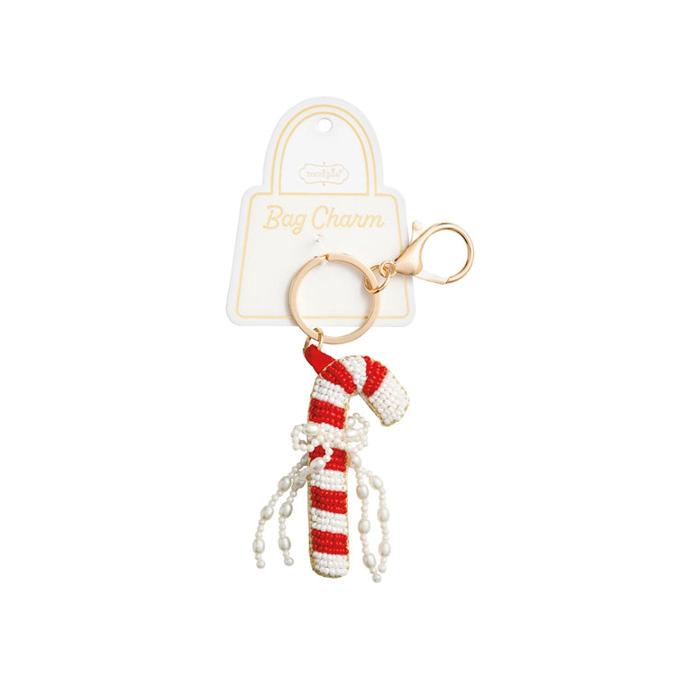 Beaded candy cane bag charm with red and white stripes, pearl bow, and gold lobster clasp.