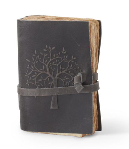 6 inch dark grey leather journal with an embossed tree design and a wrap-around tie closure.