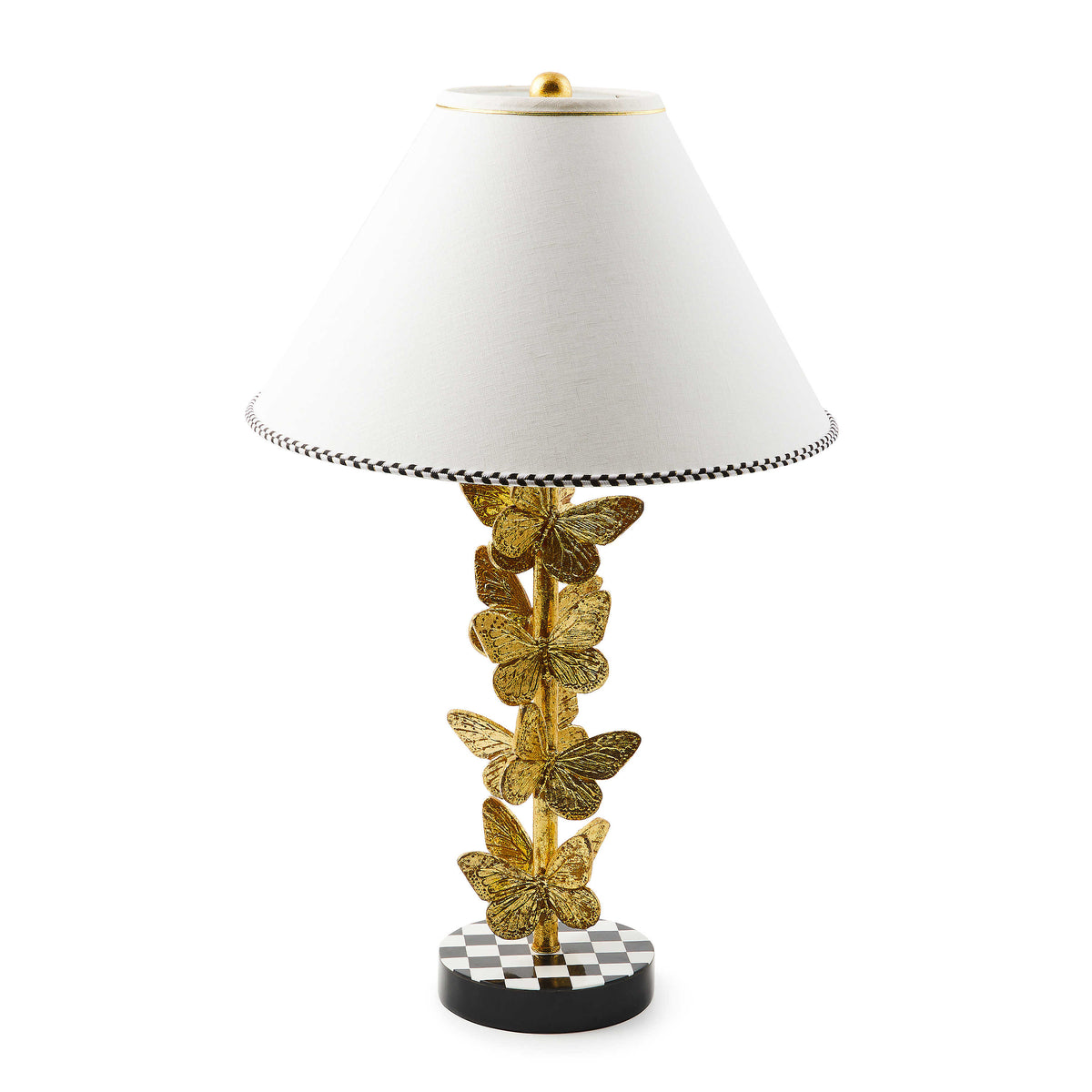 Flutter Table Lamp with a gold butterfly-adorned base and a white shade with checkered trim.