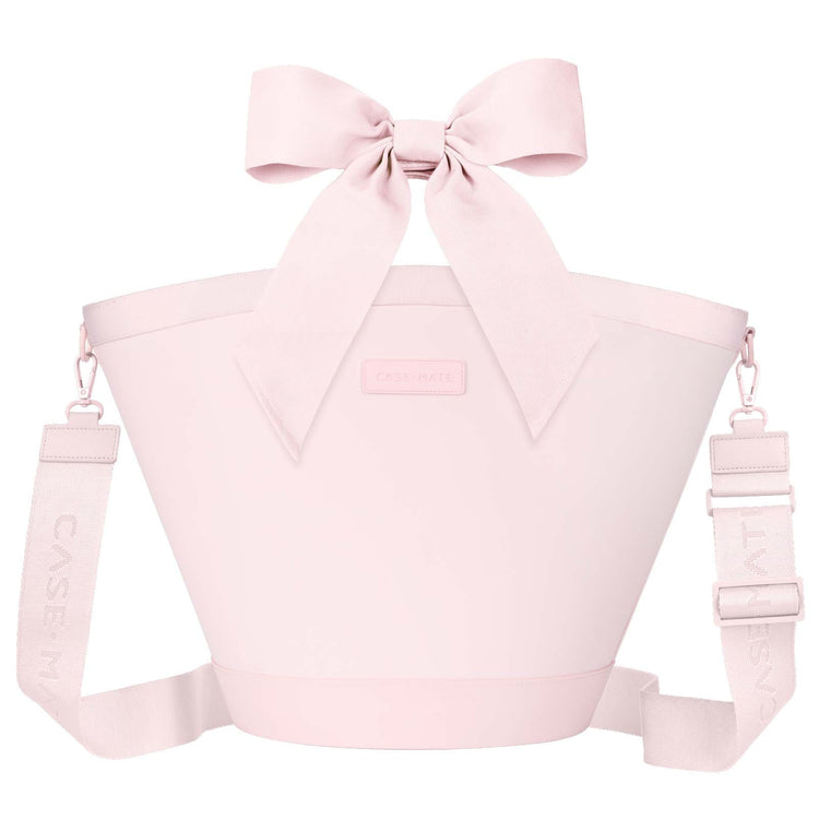 Ballet pink insulated cooler tote bag with a large decorative bow and adjustable shoulder strap.