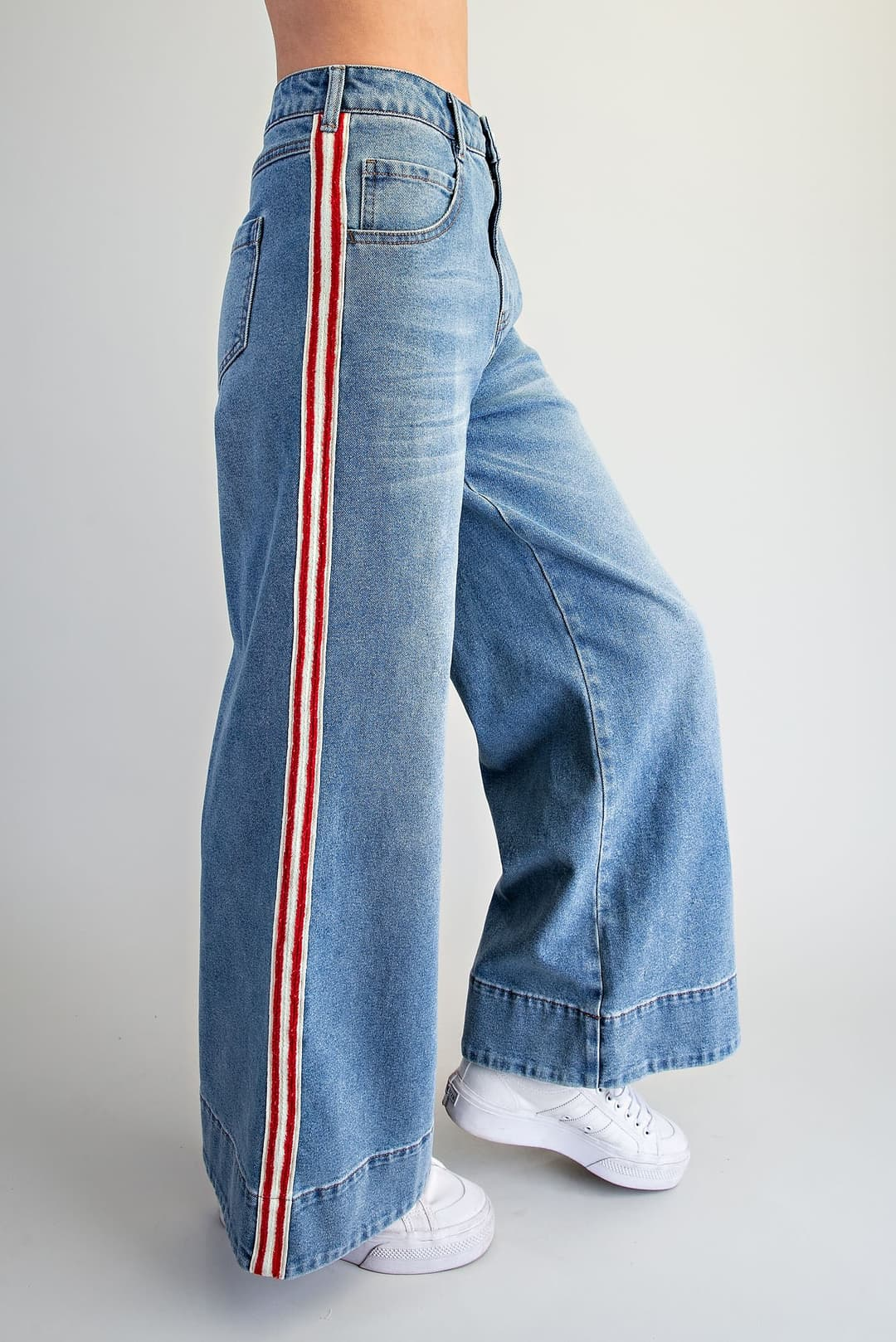Amelia high-waisted wide leg denim pants with red and white side stripes and thick bottom hem.