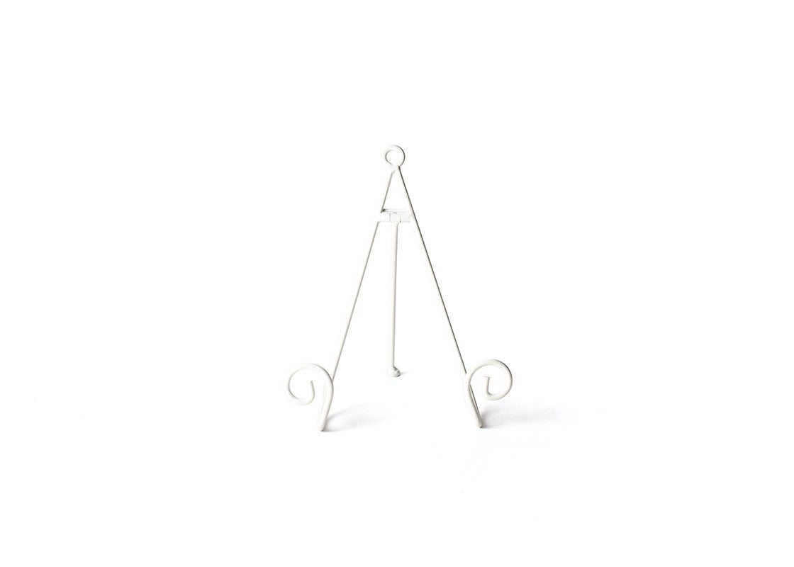 White metal medium plate stand with decorative swirl feet and a tripod design.