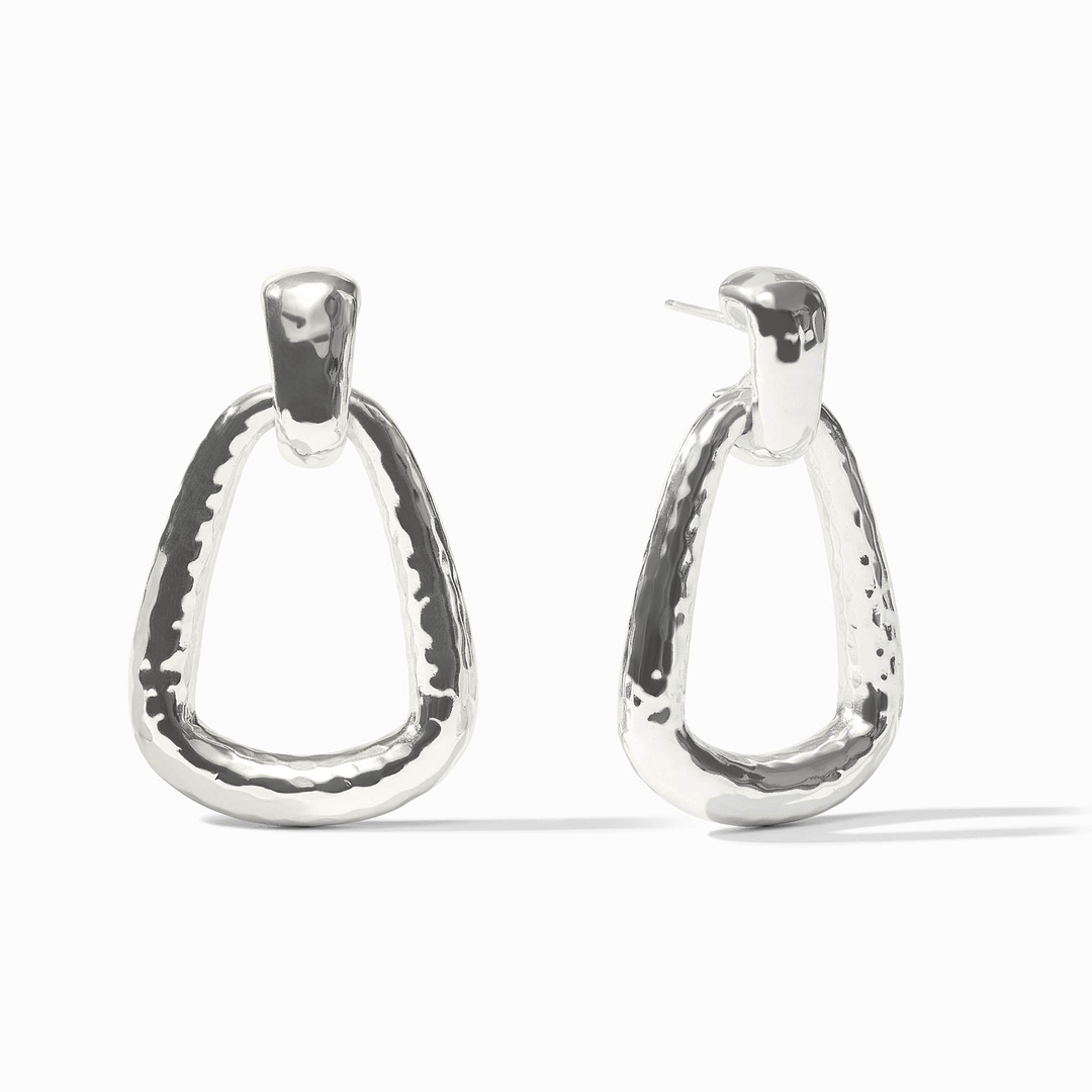 Sahara Doorknocker Earrings in silver with a hammered texture and triangular drop design.