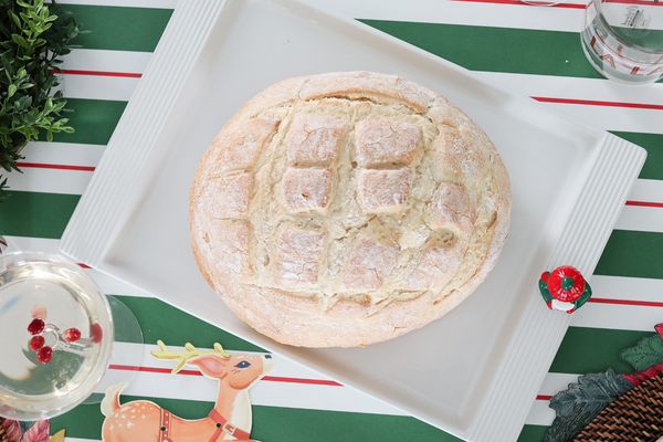 Rectangular ceramic platter with a pinstripe rim pattern in neutral tones.