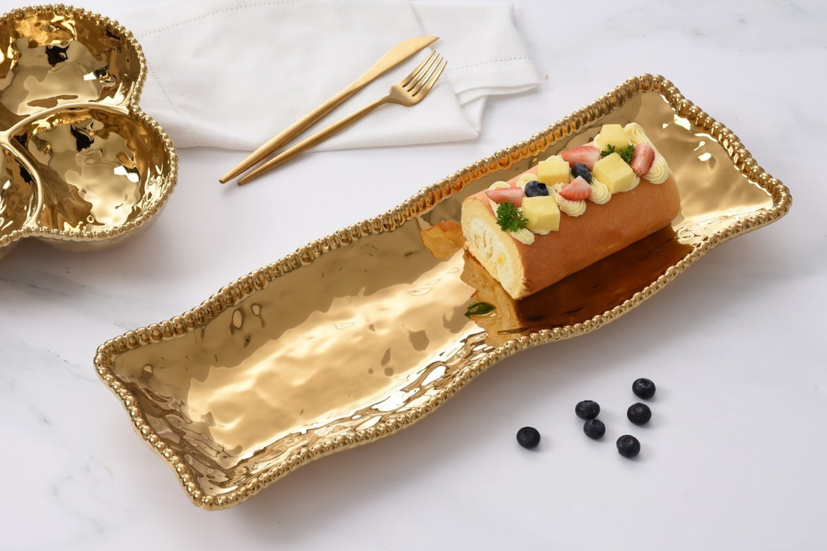 Rectangular gold-toned porcelain serving piece with lustrous gold bead detailing from the Monaco Collection.