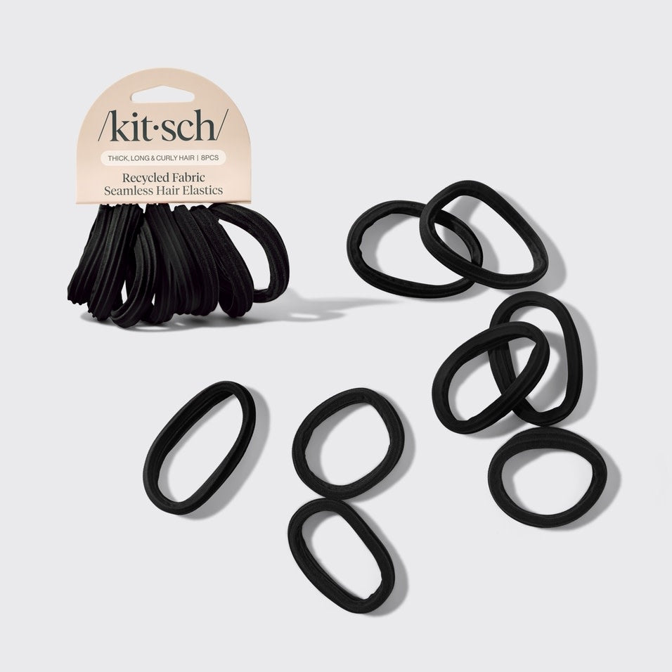Eight black recycled seamless hair elastics in a set.