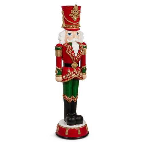 Resin nutcracker figurine with red and green accents in a classic soldier silhouette.
