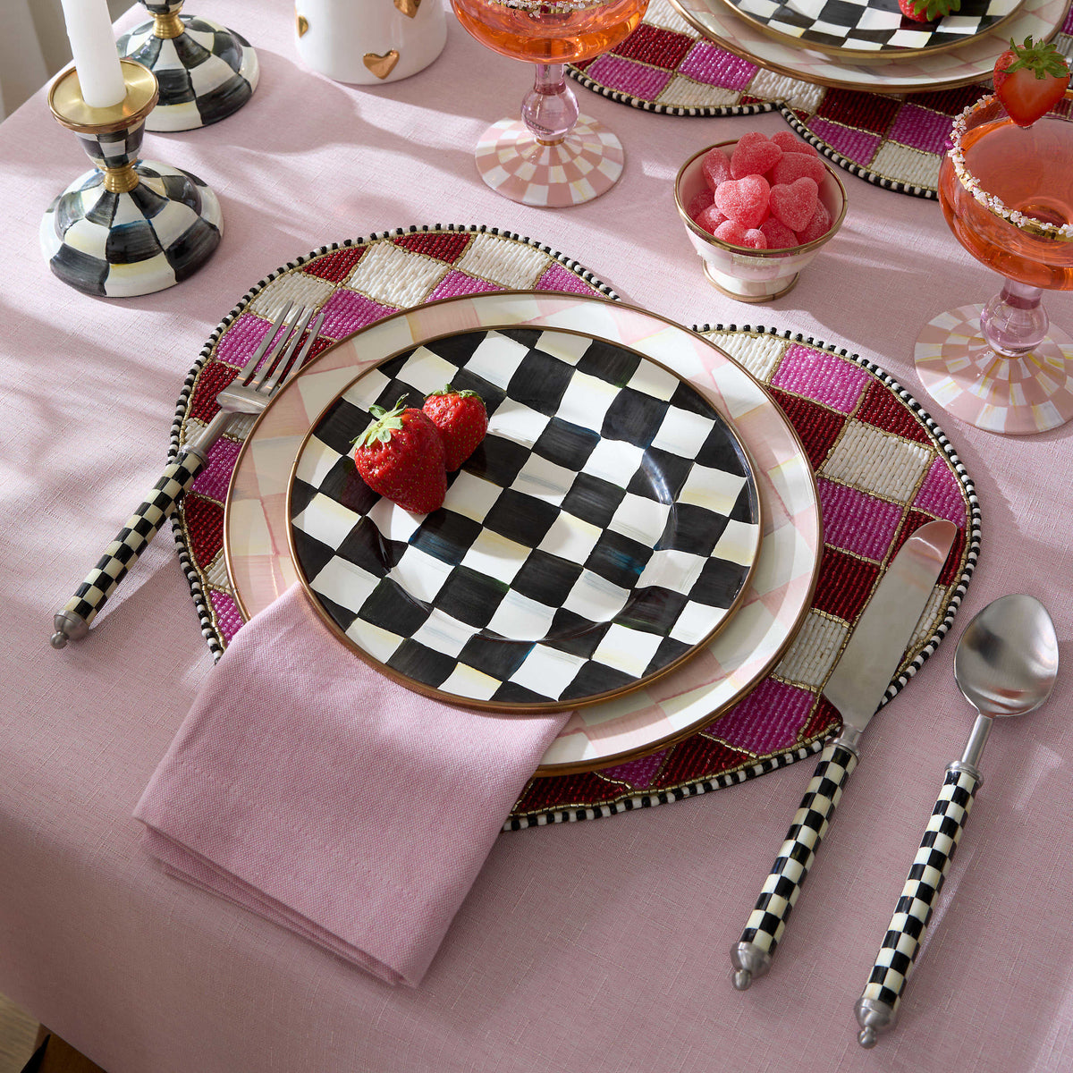 Red and white checkered heart-shaped placemat made of polyester cotton with beaded embellishments.