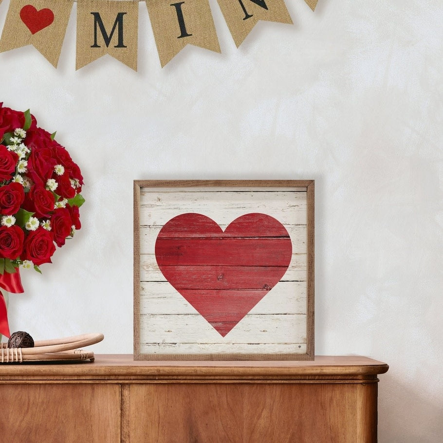 Red heart painted on whitewashed American hardwood plank framed in natural walnut
