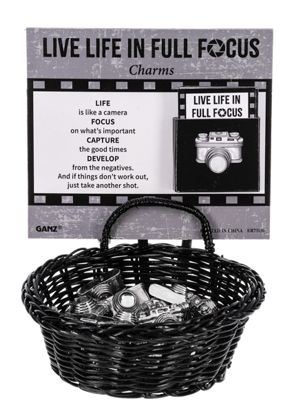 Silver zinc charm with glass focal bead featuring a focus-themed design