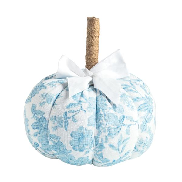 Blue and white floral patterned fabric pumpkin with a jute-wrapped stem and white grosgrain bow.
