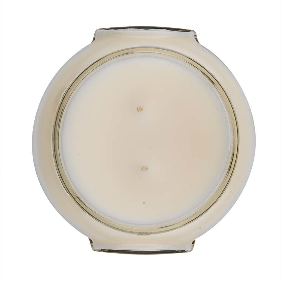 A Regal scented candle in a 22oz glass jar with a white soy and paraffin blend wax.