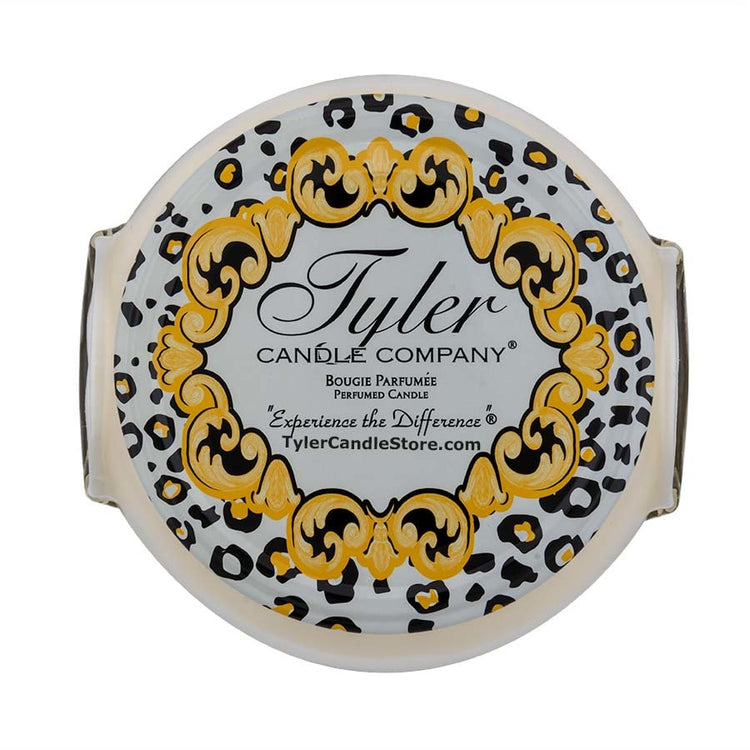 Tyler Candle Company 11oz Regal 2 wick candle with a gold baroque frame and leopard print pattern.