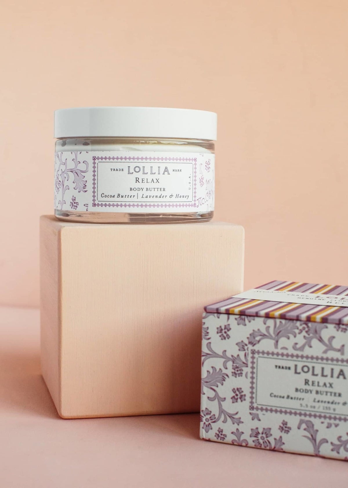 Relax Body Butter in a white jar with French floral box featuring lavender honey scent and cocoa shea butter ingredients