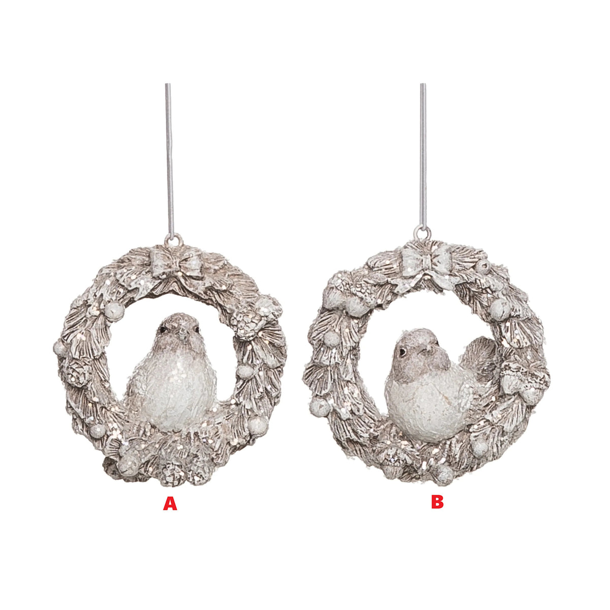 Resin ornament shaped like a winter bird holding a wreath with glitter finish