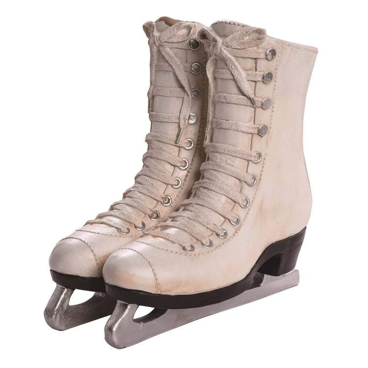 White resin planter shaped like ice skates with a circular planting hole.