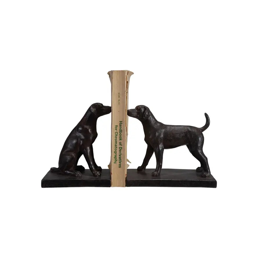 Set of two black resin dog bookends in sitting and standing poses with detailed facial features.