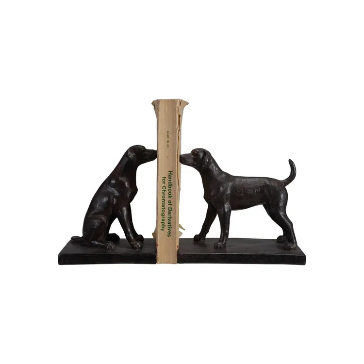 Set of two black resin dog bookends in sitting and standing poses with detailed facial features.