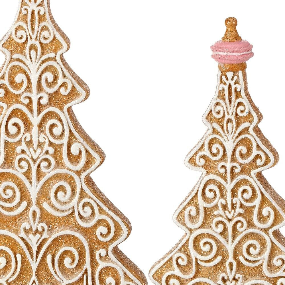 Resin gingerbread tree with white icing patterns on a dark brown trunk silhouette.