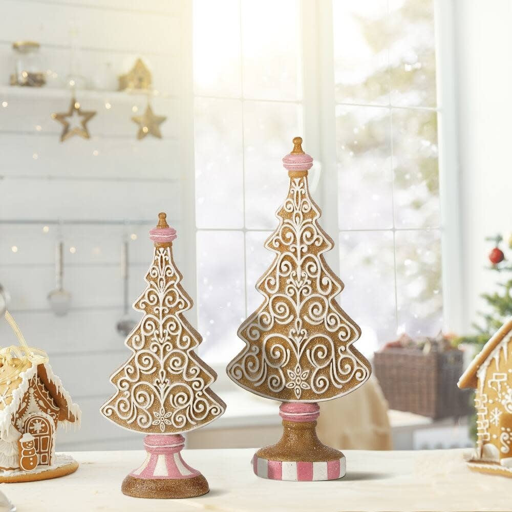 Resin gingerbread tree with white icing patterns on a dark brown trunk silhouette.