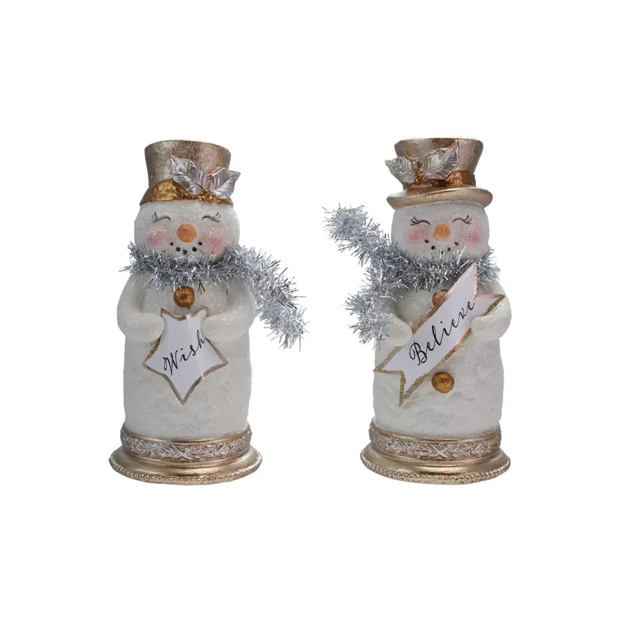 Resin snowman figurine with a red scarf holding a festive sign
