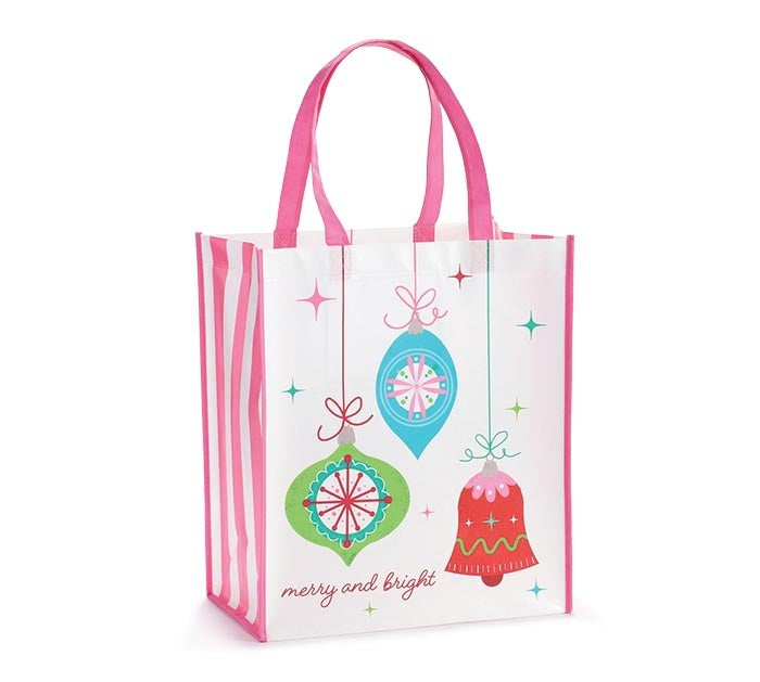 White tote bag with retro pink ornament graphics, hot pink piping handles, vertical stripes, and Merry and Bright text.