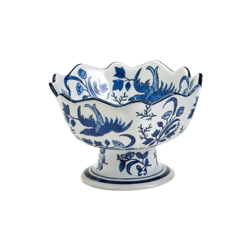 Hand-painted blue and white porcelain footed bowl with scalloped edge and bird and flower motifs.