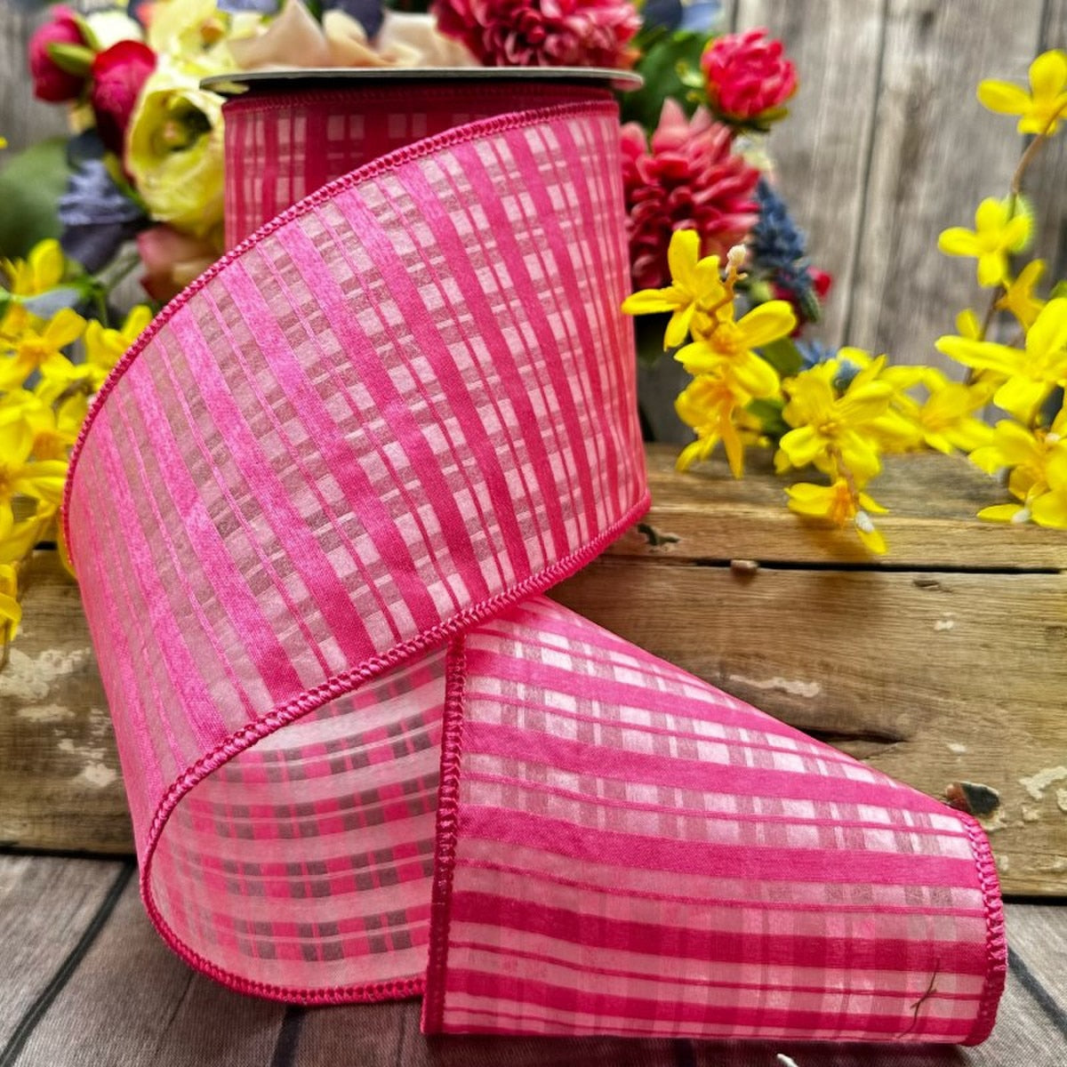 Hot pink chiffon satin plaid ribbon with a matching hot pink bow.