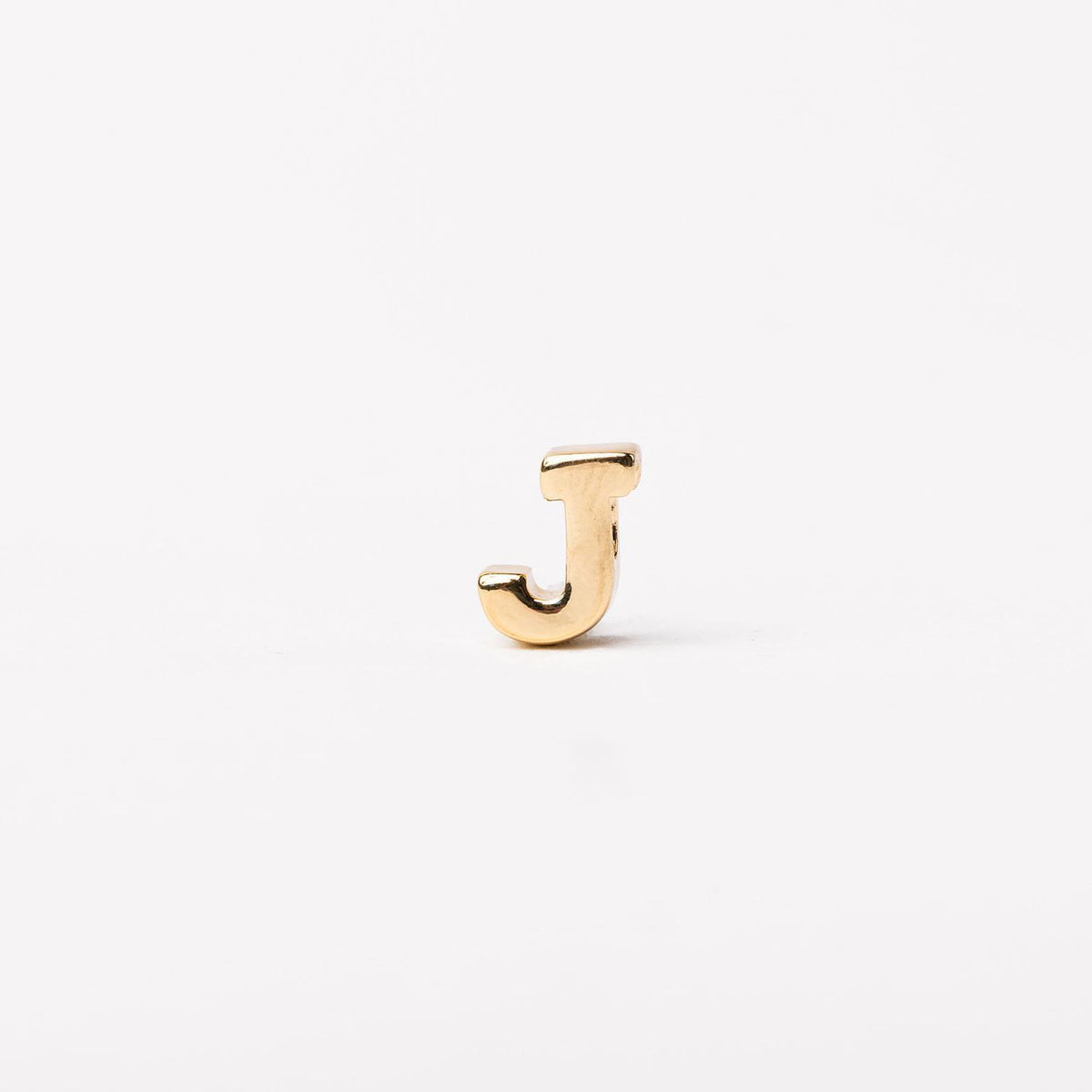 Gold-toned letter J charm with a polished finish on a plain white background.