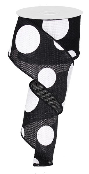 Black and white polyester ribbon with a giant polka dot pattern on a spool.