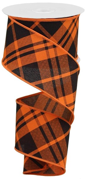 Orange and black diagonal plaid polyester ribbon on a spool.