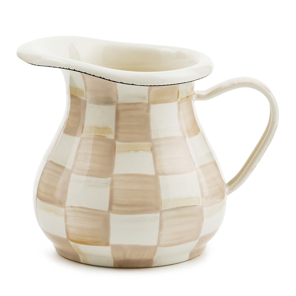 Hand-glazed steel creamer with hand-painted mocha check pattern on a rounded silhouette.