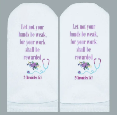 White socks featuring the Bible verse 2 Chronicles 15:7 with a floral stethoscope design.