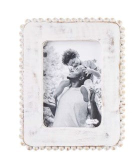 White beaded frame made from mango wood with a natural finish