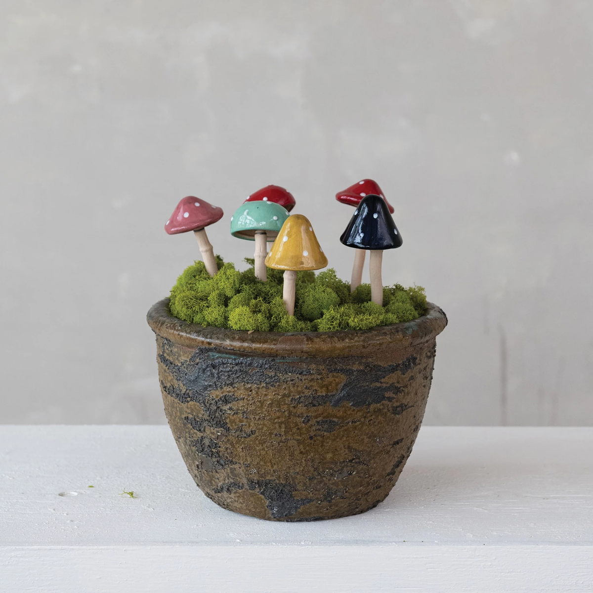 Stoneware mushroom-shaped plant stake in neutral tone with textured surface