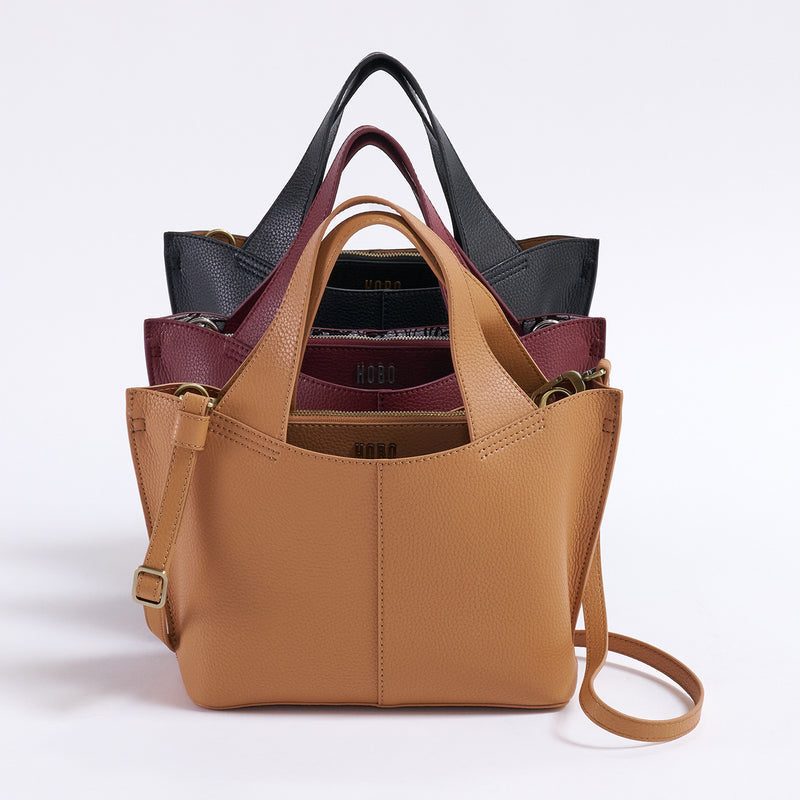 Vida small tote in biscuit leather with brushed antique brass hardware.